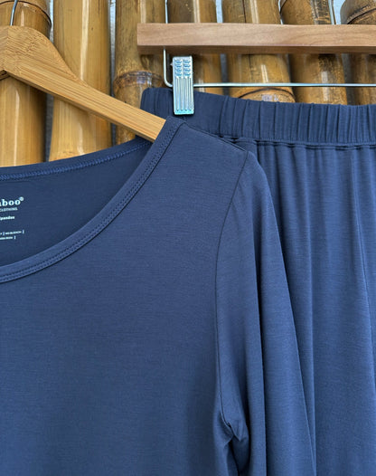 Close-up of the Blue Graphite Spun Bamboo lounge tee neckline, shoulder seam and fabric; trousers behind it are not included.