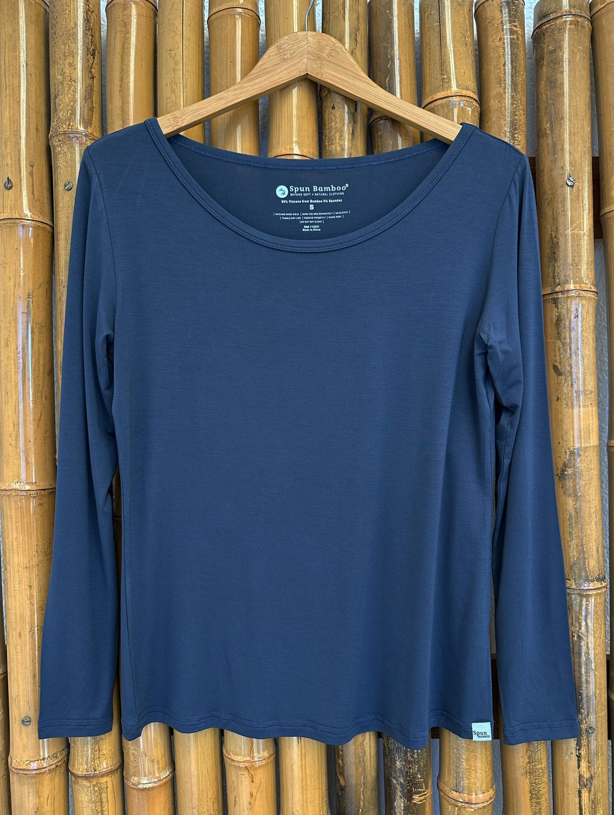 Spun Bamboo women's long-sleeve lounge tee in Blue Graphite on a hanger, showing the full front and neckline.