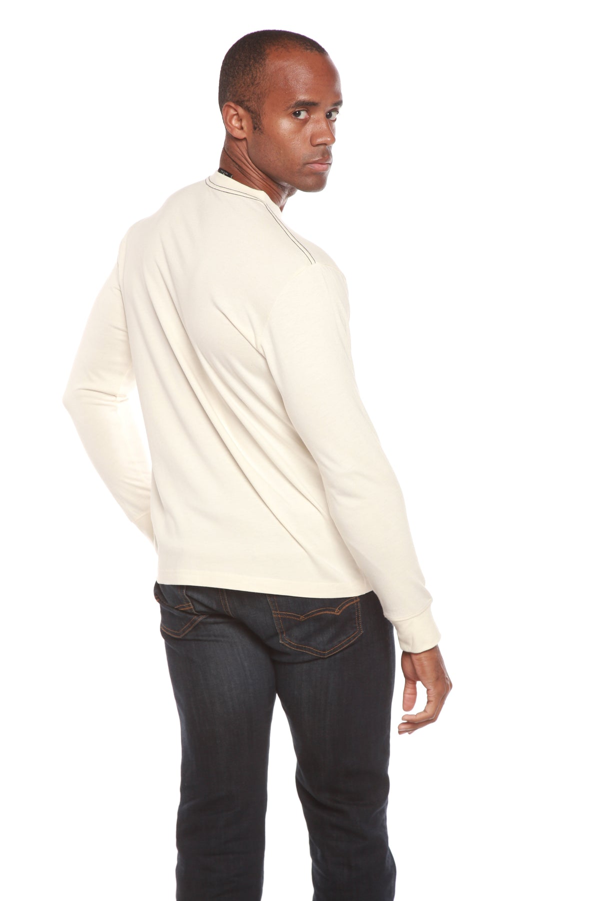 Rear view of the Spun Bamboo long-sleeve crewneck in Natural, showing the back and ribbed cuffs.