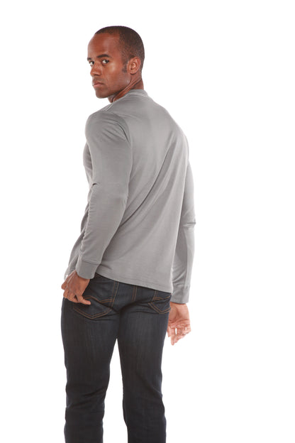 Rear three-quarter view of a grey Spun Bamboo long-sleeve crewneck, styled with dark jeans.
