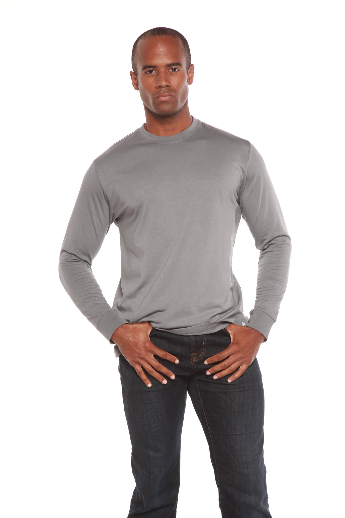 Grey Spun Bamboo crewneck shown from the front, styled with dark jeans against a white background.