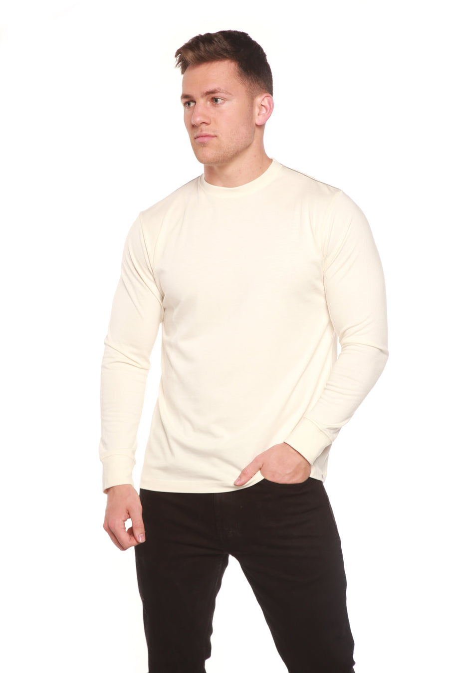 Front view of the Spun Bamboo long-sleeve crewneck in Natural, styled with black trousers.